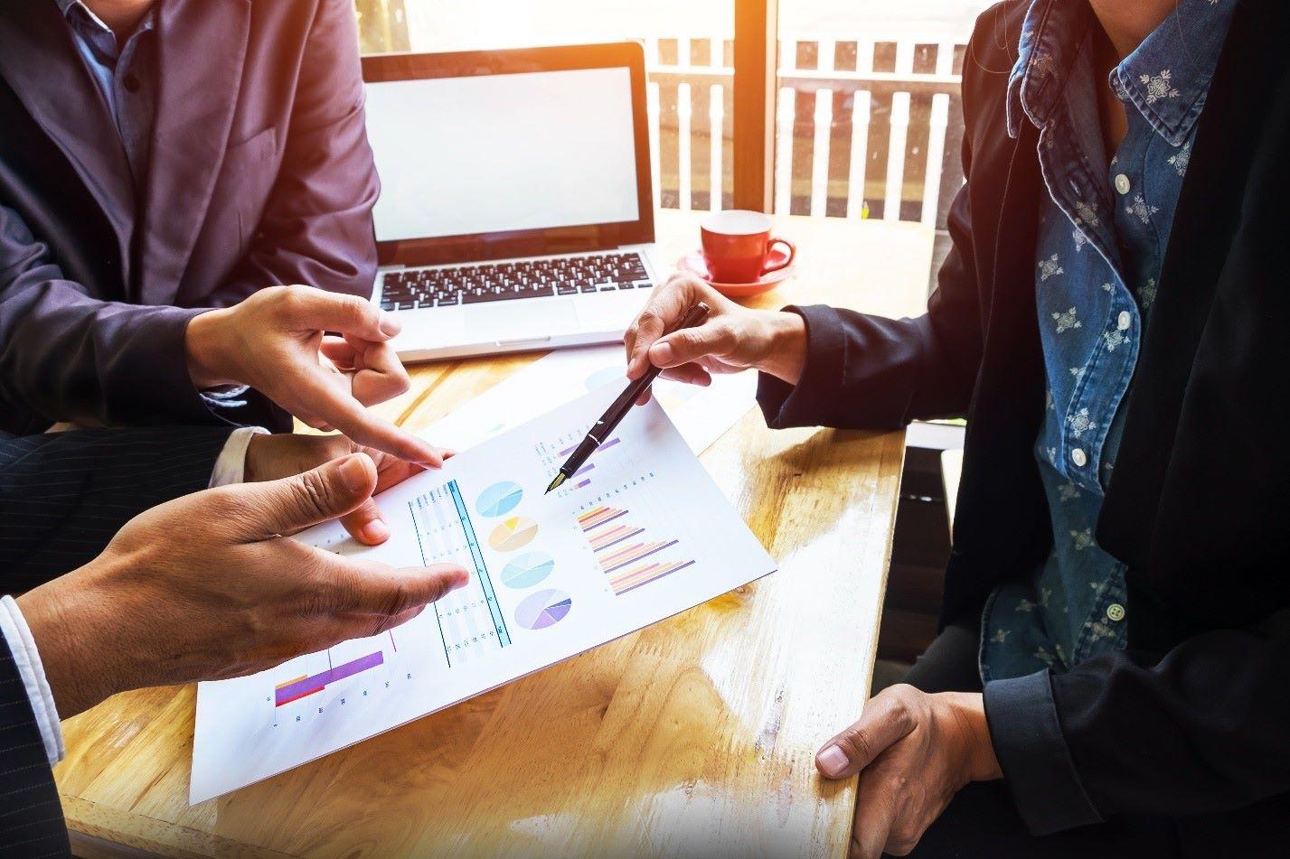Advisors reviewing charts during a complex securities valuation discussion
